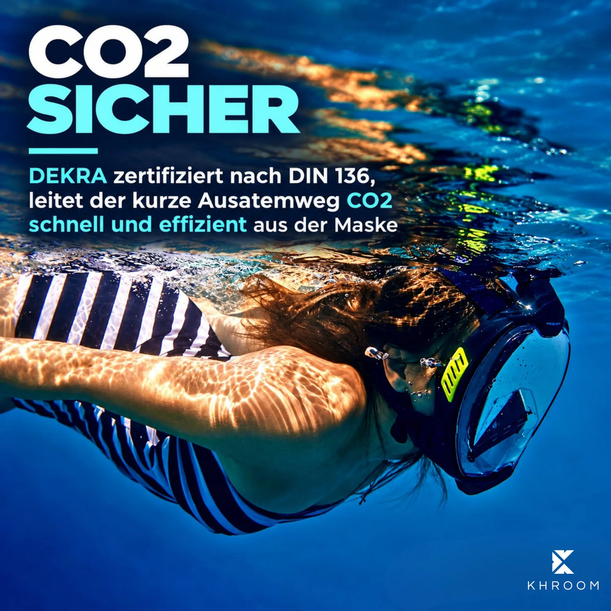 Frau schnorchelt unter Wasser mit der Khroom Seaview X Vollgesichtsmaske in Schwarz-Gelb: CO2-sicher, der kurze Ausatemweg leitet die Atemluft schnell aus der Maske